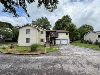 5125 S Walnut Hill Rd, Springfield, MO 65810 - view of front of home featuring asphalt driveway and an attached garage