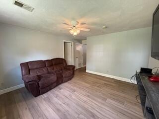5125 S Walnut Hill Rd, Springfield, MO 65810 - living area featuring a ceiling fan and wood finished floors