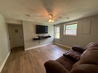 5125 S Walnut Hill Rd, Springfield, MO 65810 - living area featuring wood finished floors and ceiling fan