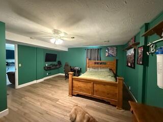 5125 S Walnut Hill Rd, Springfield, MO 65810 - bedroom featuring wood finished floors and baseboards