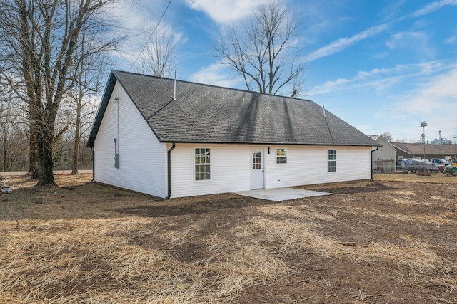 305 Crescent St, Aurora, MO 65605 - back of property with a patio area and a shingled roof