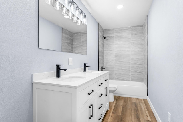 305 Crescent St, Aurora, MO 65605 - full bathroom with double vanity, bathtub / shower combination, and wood finished floors