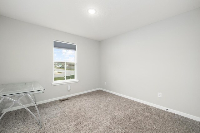 2801 E Bradford St, Republic, MO 65738 - carpeted empty room with baseboards and recessed lighting