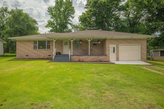 212 N School St, Goodman, MO 64843 - single story home with covered porch, an attached garage, a front yard, and driveway