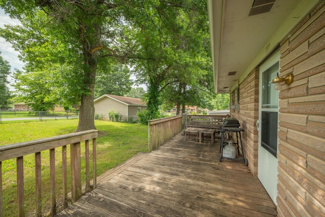 212 N School St, Goodman, MO 64843 - wooden terrace featuring a lawn