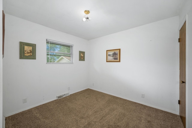 212 N School St, Goodman, MO 64843 - carpeted empty room featuring baseboards
