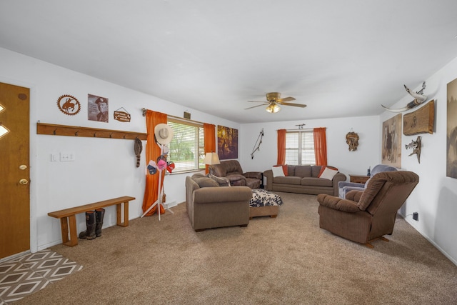 212 N School St, Goodman, MO 64843 - carpeted living area featuring healthy amount of natural light and ceiling fan