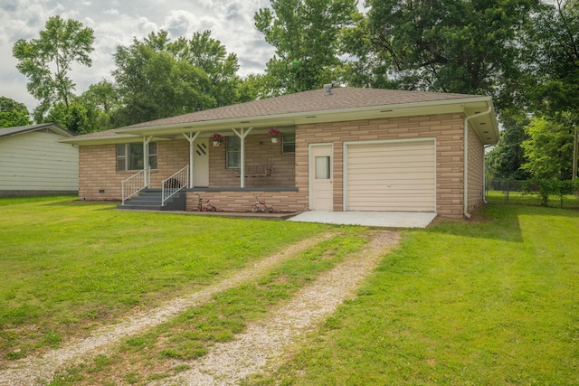 212 N School St, Goodman, MO 64843 - ranch-style house featuring dirt driveway, covered porch, a garage, and brick siding