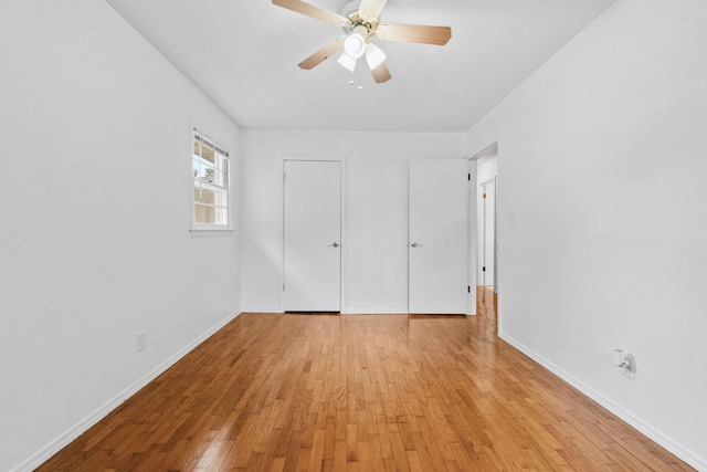 1541 E Crestview St, Springfield, MO 65804 - unfurnished bedroom with light wood finished floors and a ceiling fan