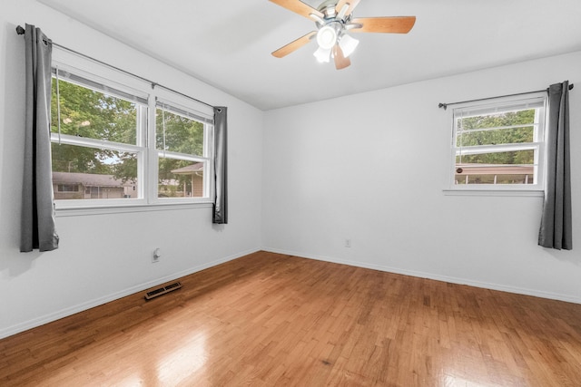 1541 E Crestview St, Springfield, MO 65804 - spare room with healthy amount of natural light, light wood-type flooring, and a ceiling fan