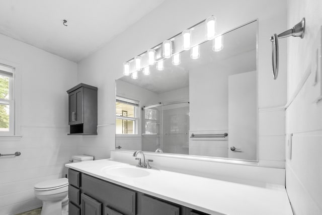 1541 E Crestview St, Springfield, MO 65804 - full bathroom with a shower stall, vanity, plenty of natural light, tile walls, and wainscoting