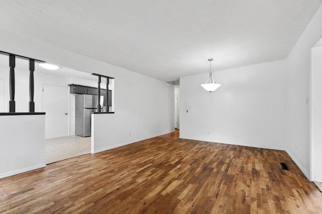 1541 E Crestview St, Springfield, MO 65804 - spare room featuring wood finished floors and baseboards