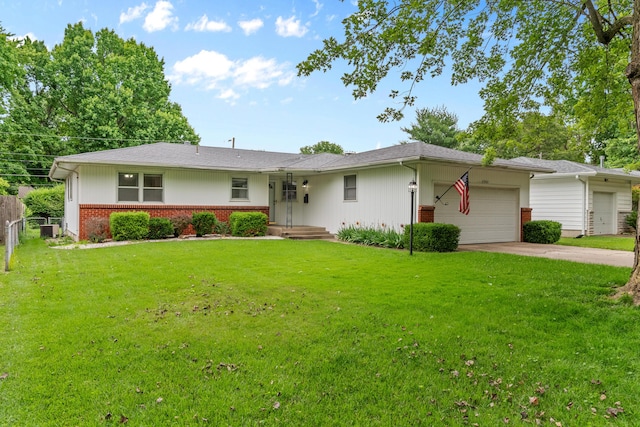 1541 E Crestview St, Springfield, MO 65804 - single story home featuring a garage, driveway, and brick siding