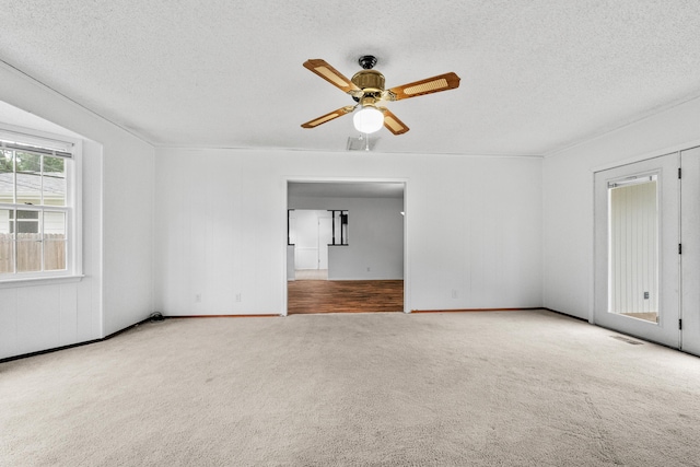 1541 E Crestview St, Springfield, MO 65804 - carpeted empty room with a ceiling fan and a textured ceiling