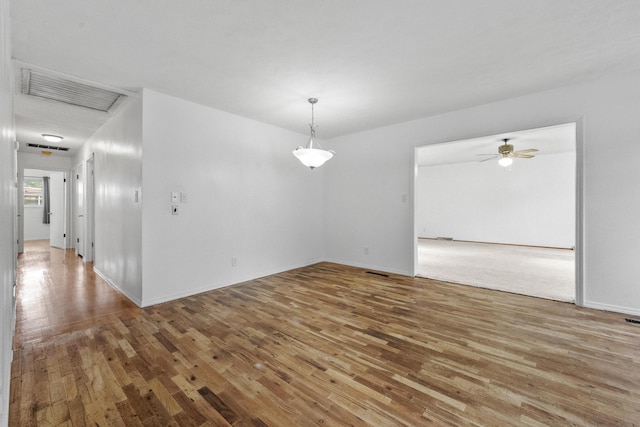 1541 E Crestview St, Springfield, MO 65804 - spare room featuring wood finished floors and a ceiling fan