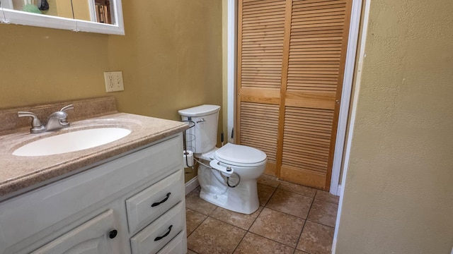 1160 Bethel Ave, Mammoth Spring, AR 72554 - bathroom with vanity, a closet, and tile patterned flooring