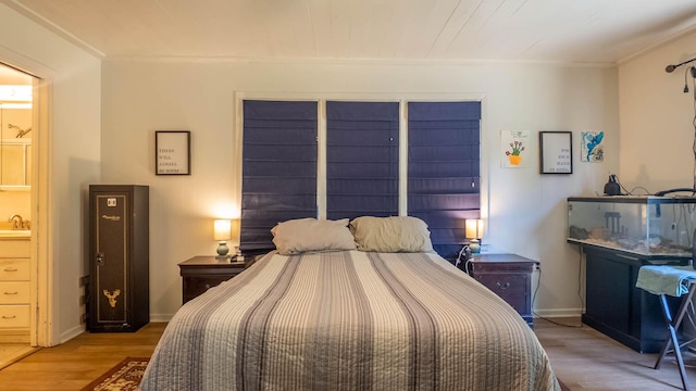 1160 Bethel Ave, Mammoth Spring, AR 72554 - bedroom with wood finished floors and ornamental molding