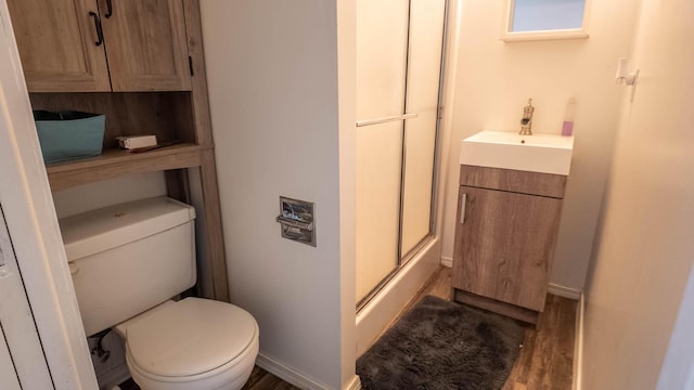 1160 Bethel Ave, Mammoth Spring, AR 72554 - bathroom featuring a shower with door, wood finished floors, and vanity