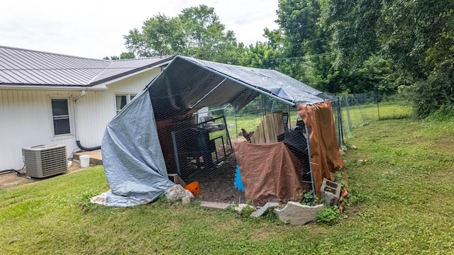 1160 Bethel Ave, Mammoth Spring, AR 72554 - view of side of property with exterior structure, a metal roof, and an outbuilding