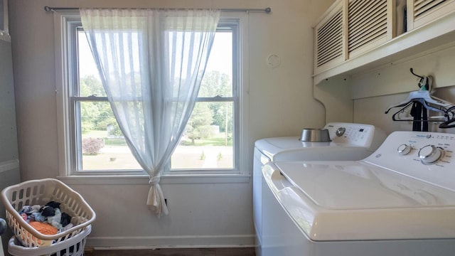 1160 Bethel Ave, Mammoth Spring, AR 72554 - washroom featuring separate washer and dryer and cabinet space