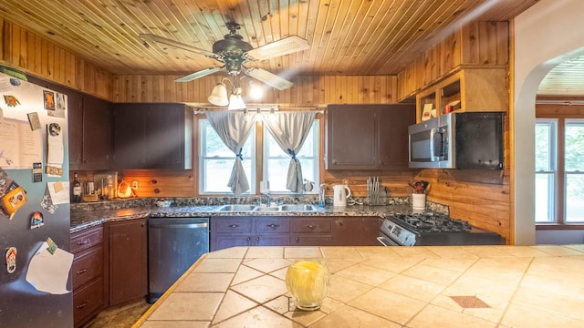 1160 Bethel Ave, Mammoth Spring, AR 72554 - kitchen featuring stainless steel appliances, tile countertops, wood ceiling, a ceiling fan, and arched walkways