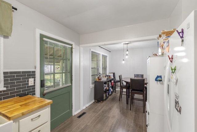1547 S Kickapoo Ave, Springfield, MO 65804 - dining space with dark wood-style floors