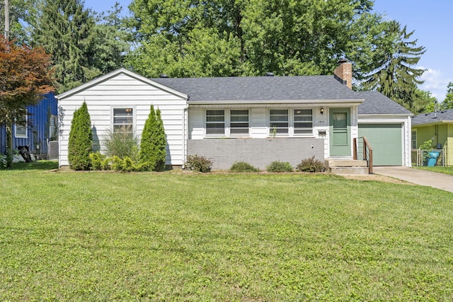 1547 S Kickapoo Ave, Springfield, MO 65804 - ranch-style house with a chimney, a front yard, concrete driveway, and brick siding