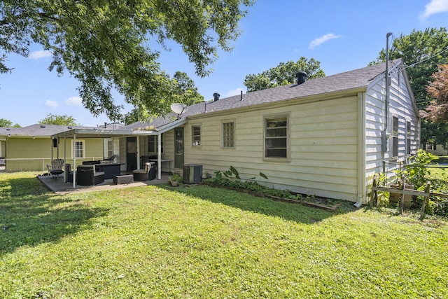 1547 S Kickapoo Ave, Springfield, MO 65804 - back of property with an outdoor living space, a patio, and roof with shingles