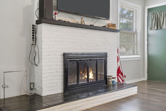 1547 S Kickapoo Ave, Springfield, MO 65804 - detailed view of a brick fireplace and wood finished floors