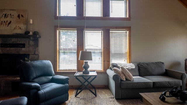 4534 Bayou Access Rd, Mammoth Spring, AR 72554 - living room featuring plenty of natural light, a fireplace, and a high ceiling
