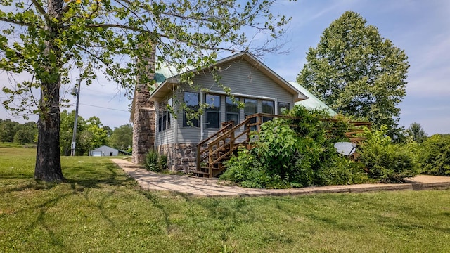 4534 Bayou Access Rd, Mammoth Spring, AR 72554 - view of property exterior with a yard, a chimney, and stairs