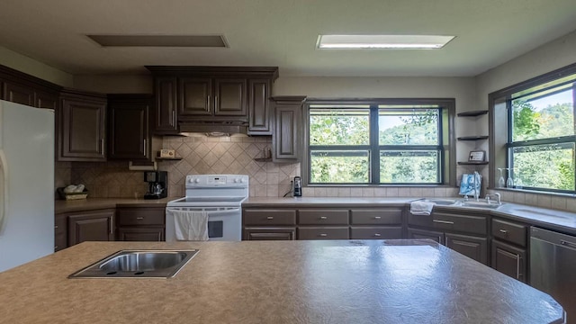 4534 Bayou Access Rd, Mammoth Spring, AR 72554 - kitchen featuring white appliances, backsplash, and light countertops