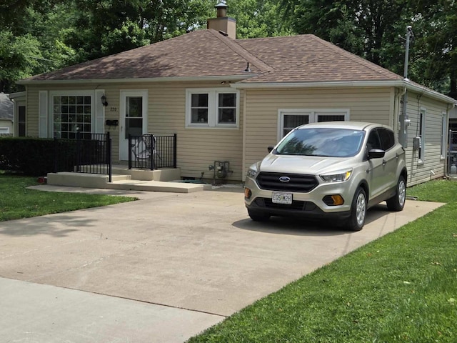 220 E Portland St, Springfield, MO 65807 - view of front of home with a chimney and roof with shingles