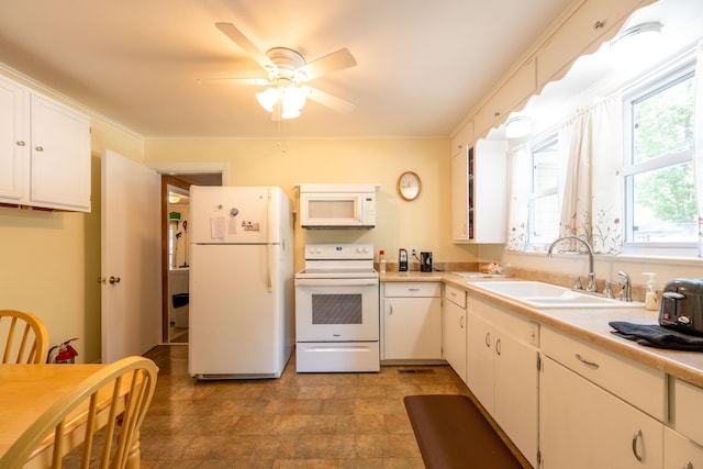 220 E Portland St, Springfield, MO 65807 - kitchen with white appliances, a ceiling fan, light countertops, white cabinetry, and crown molding