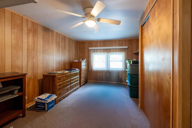 220 E Portland St, Springfield, MO 65807 - bedroom featuring carpet floors, wooden walls, and ceiling fan