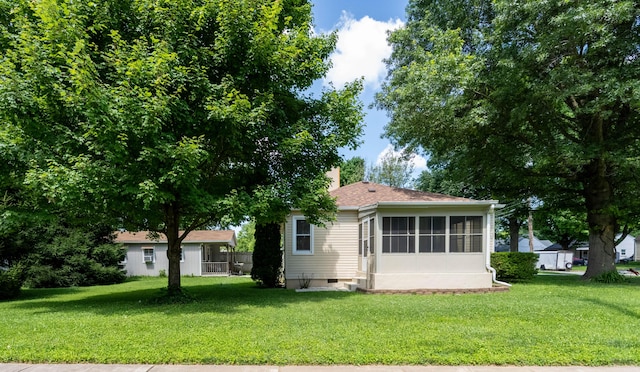 220 E Portland St, Springfield, MO 65807 - view of front of property with a front yard, a sunroom, a chimney, and crawl space