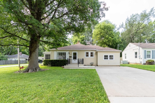 220 E Portland St, Springfield, MO 65807 - view of front of house with concrete driveway and a chimney