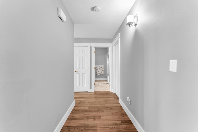 3318 Winged Foot Dr, Nixa, MO 65714 - hallway featuring wood finished floors and baseboards