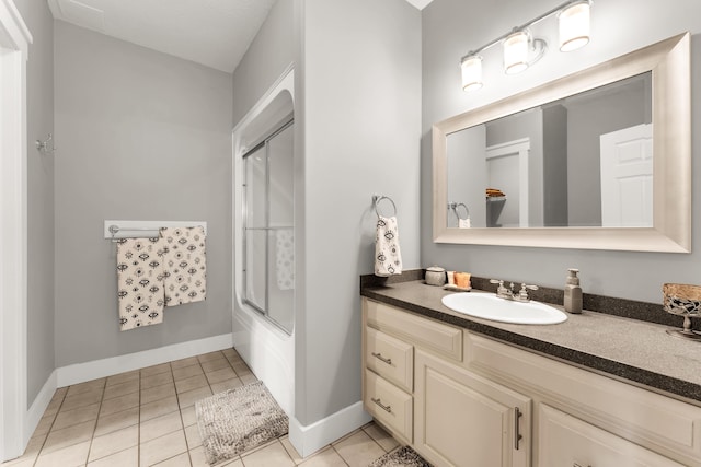 3318 Winged Foot Dr, Nixa, MO 65714 - full bathroom with vanity, tile patterned floors, and bath / shower combo with glass door