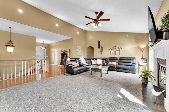 3318 Winged Foot Dr, Nixa, MO 65714 - living room featuring ceiling fan, a glass covered fireplace, carpet flooring, vaulted ceiling, and recessed lighting