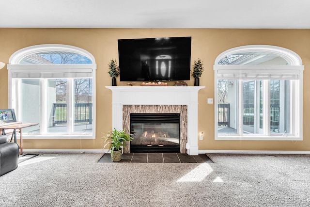 3318 Winged Foot Dr, Nixa, MO 65714 - carpeted living area with a fireplace with flush hearth and baseboards