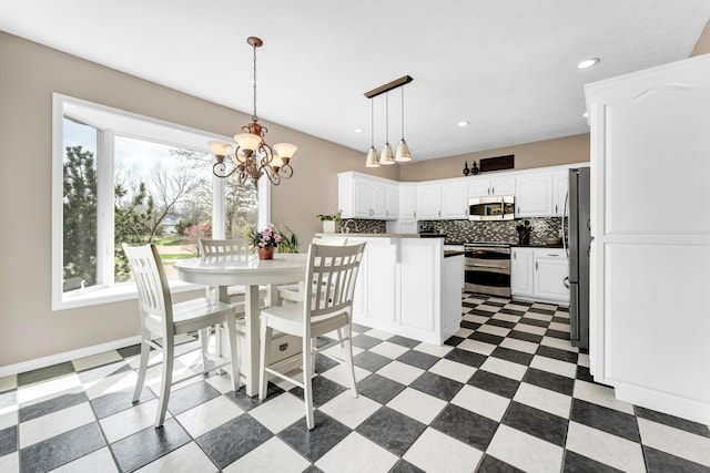 3318 Winged Foot Dr, Nixa, MO 65714 - dining area with a chandelier, recessed lighting, and light floors