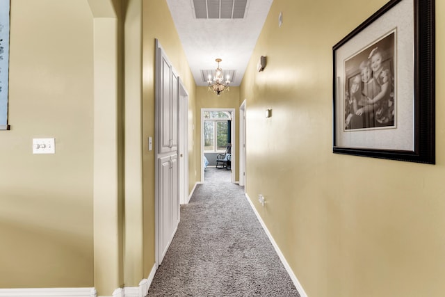 3318 Winged Foot Dr, Nixa, MO 65714 - hallway with carpet, a chandelier, and arched walkways