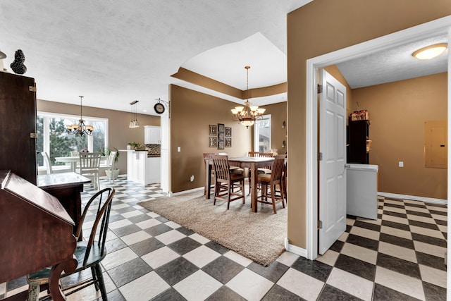 3318 Winged Foot Dr, Nixa, MO 65714 - dining area featuring a chandelier, electric panel, tile patterned floors, and a tray ceiling