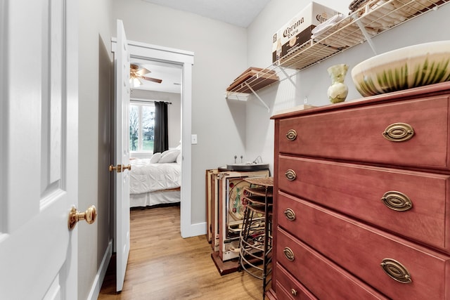 3318 Winged Foot Dr, Nixa, MO 65714 - spacious closet featuring light wood-style flooring and ceiling fan