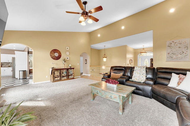 3318 Winged Foot Dr, Nixa, MO 65714 - living room with arched walkways, a ceiling fan, carpet, and lofted ceiling