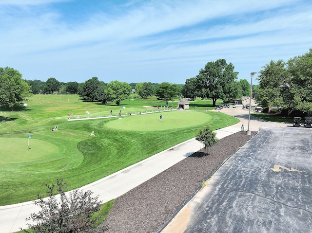 3318 Winged Foot Dr, Nixa, MO 65714 - view of property's community featuring an area to practice putting, view of golf course, and view of scattered trees