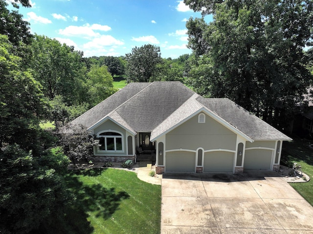 3318 Winged Foot Dr, Nixa, MO 65714 - ranch-style house featuring an attached garage, a shingled roof, a front lawn, driveway, and stone siding