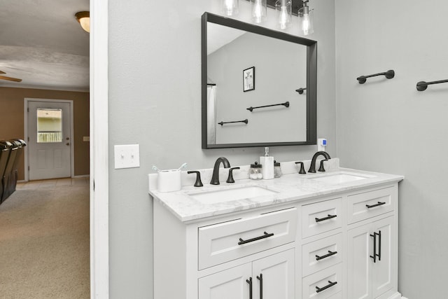 111 E Yorkshire St, Nixa, MO 65714 - full bathroom with double vanity and a ceiling fan