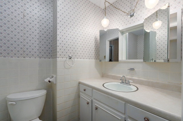 13762 State Highway Z, Verona, MO 65769 - bathroom featuring wallpapered walls, vanity, tile walls, and a wainscoted wall